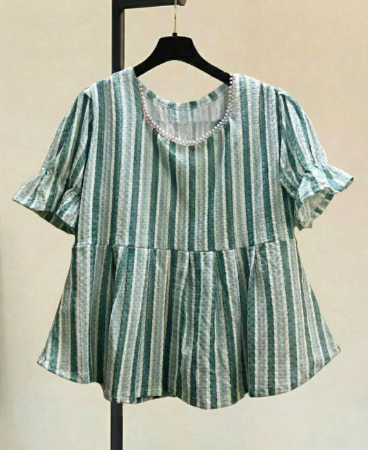 Brighten up your wardrobe with this elegant pastel green striped top, designed for both comfort and style. The soft pearl detailing on the neckline adds a subtle touch of charm, making it ideal for casual outings, brunches, or office wear.
